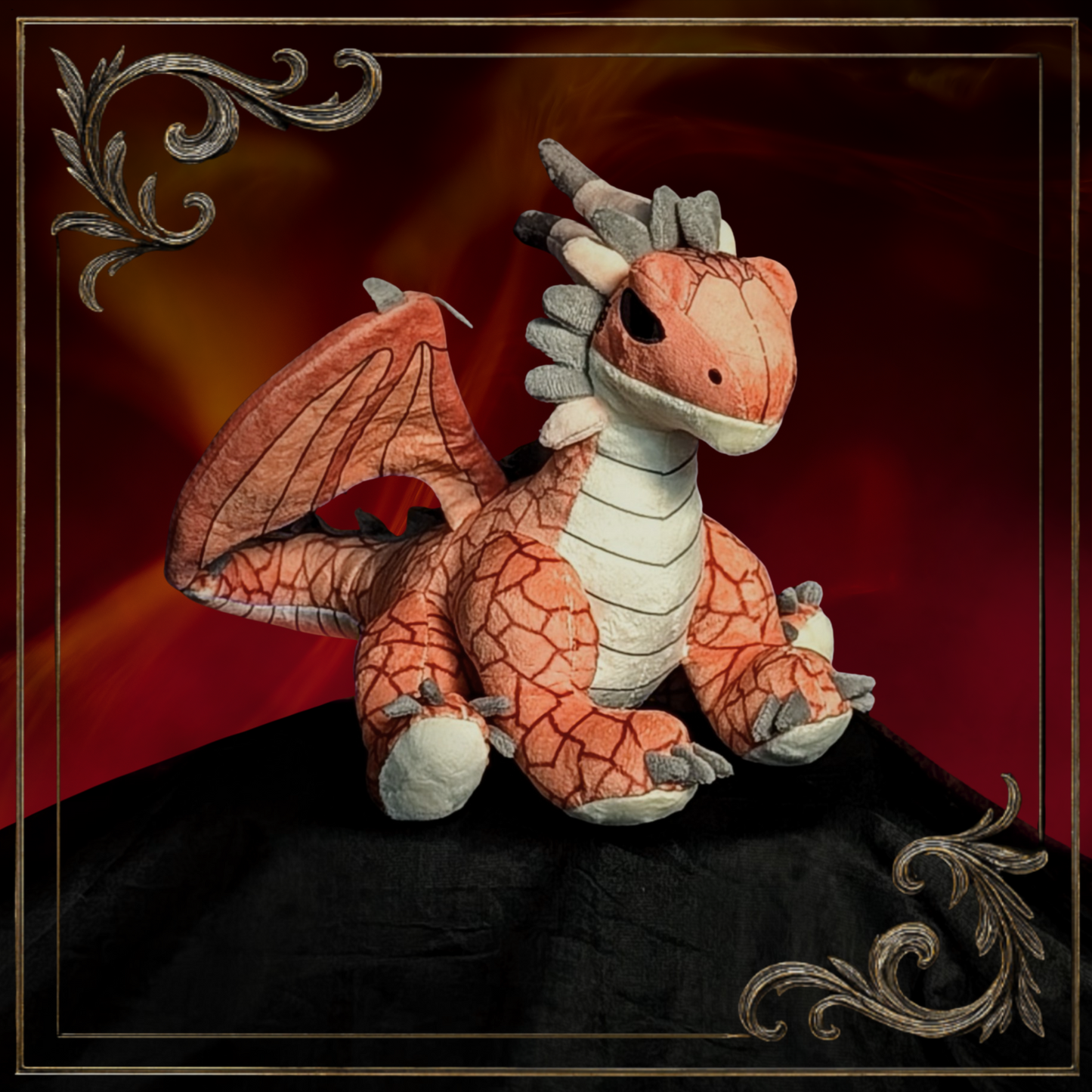 Plush dragon toy with orange and white pattern on a dark background