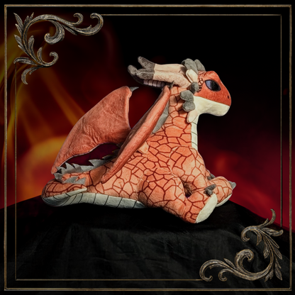 Plush dragon toy with blue eyes 